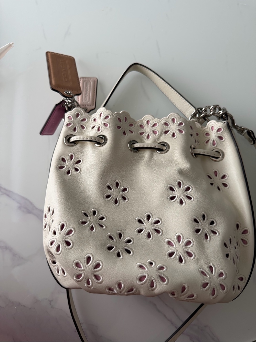 Coach Poppy White Floral Eyelet Drawstring Bucket Bag with Pink Underlay